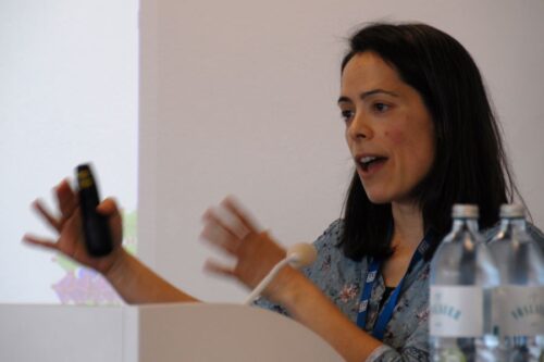 Speaker Marta Gibert behind the lectern