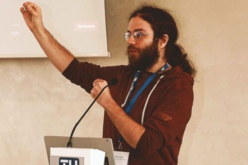 Speaker Marcus Huber behind the lectern