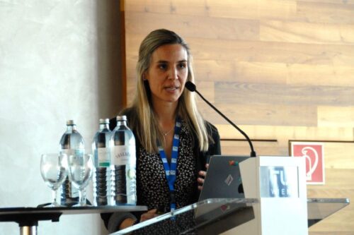 Speaker Kimberly Modic behind the lectern