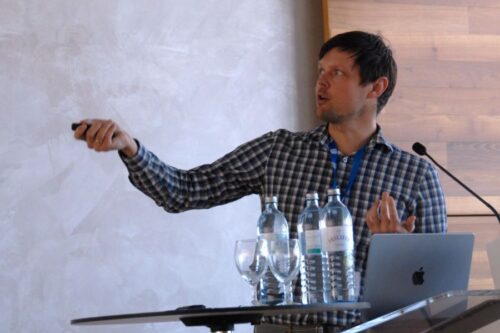 Speaker Maksym Serbyn behind the lectern